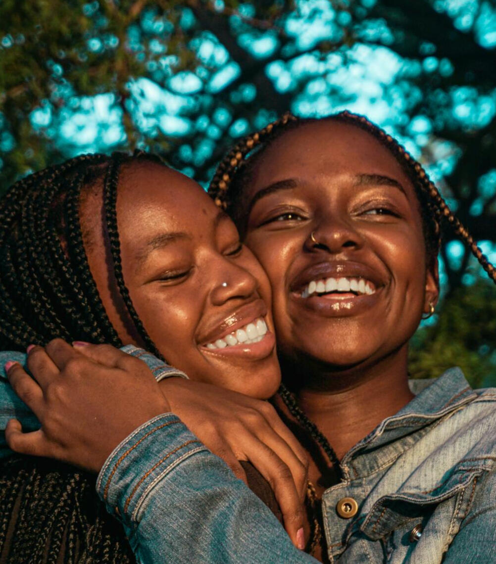 girls smiling together