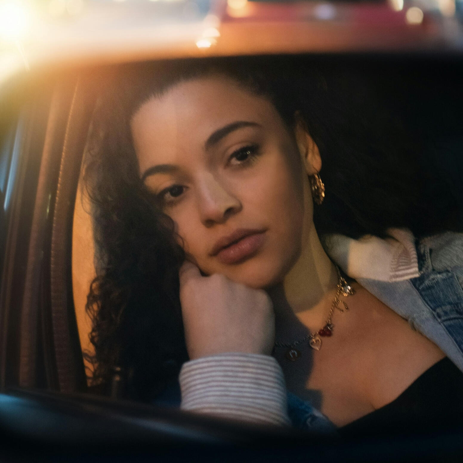girl with braids smiling
