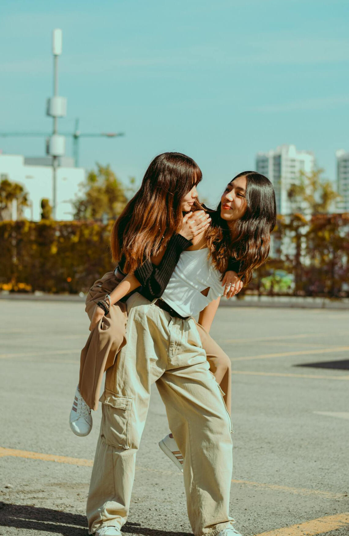 a girl getting a piggyback ride from her friend