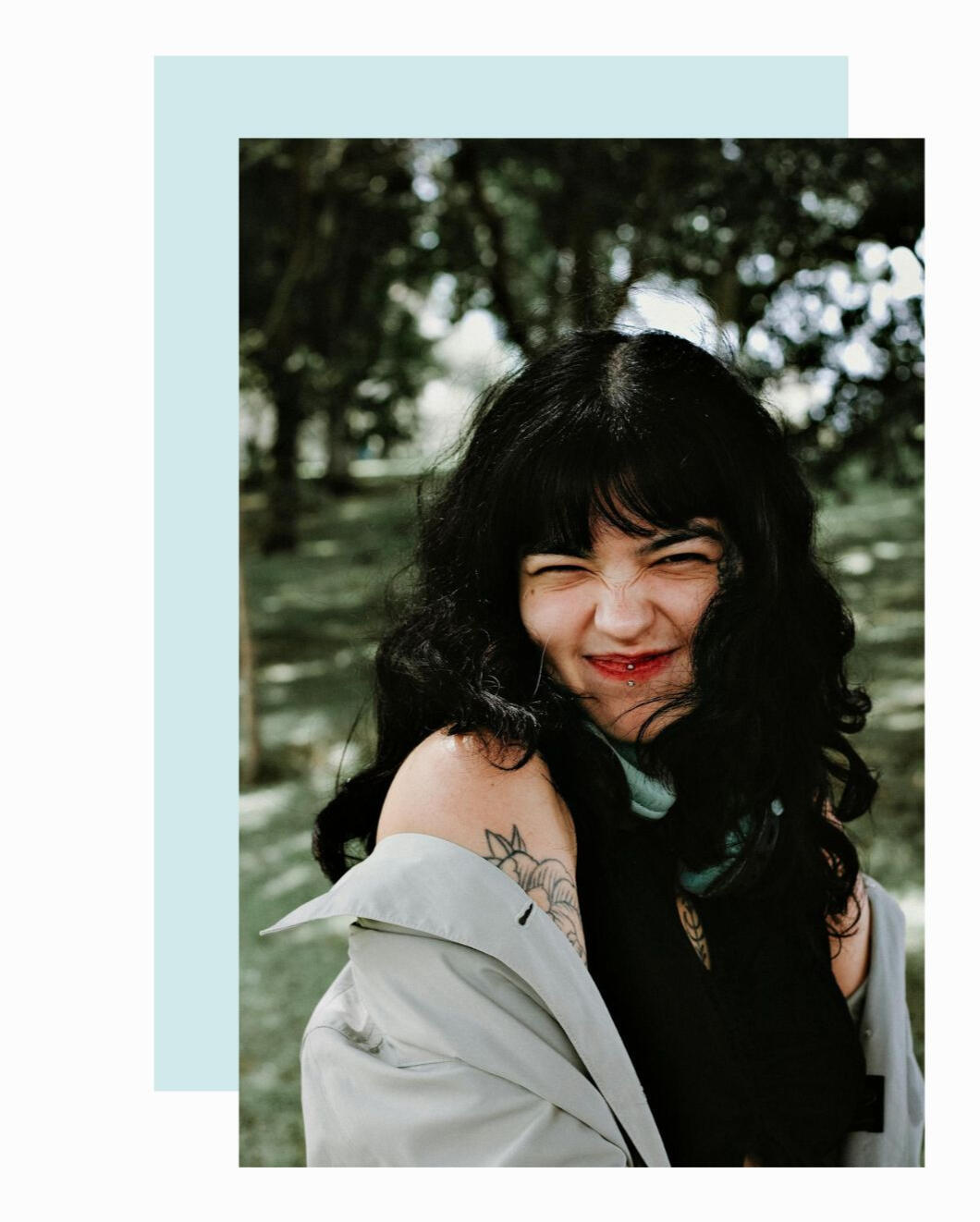 girl with bangs smiling