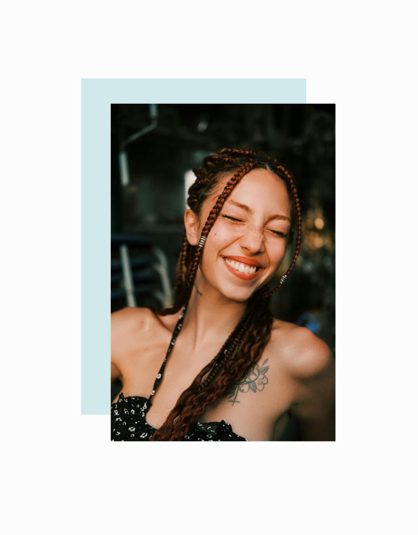 girl with braids smiling