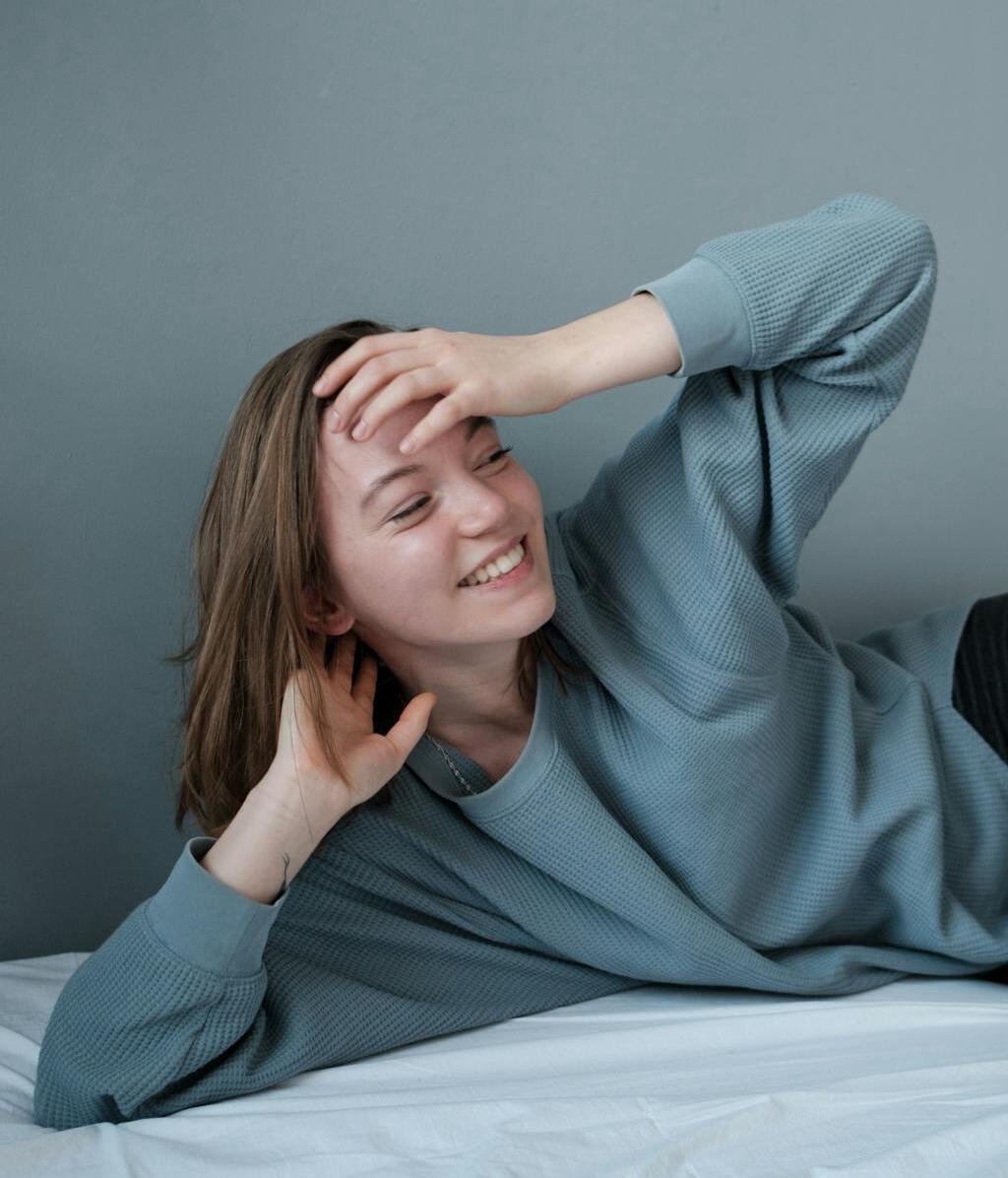 girl with braids smiling