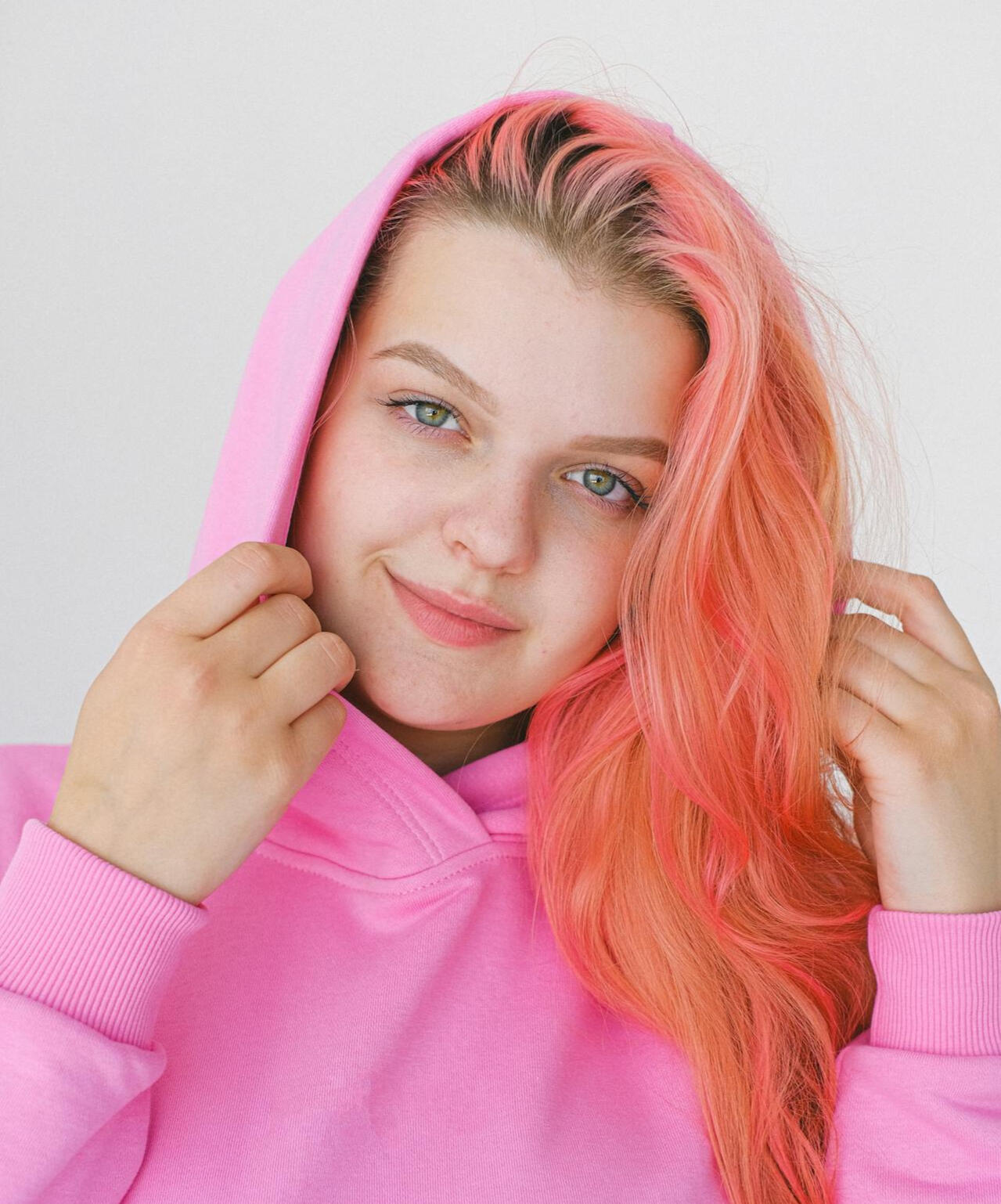 girl with pink hair in pink hoodie