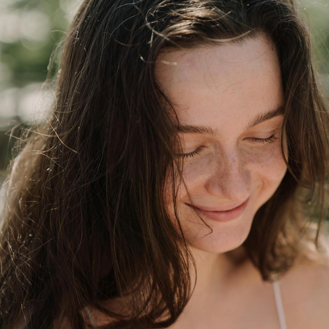 girl with braids smiling